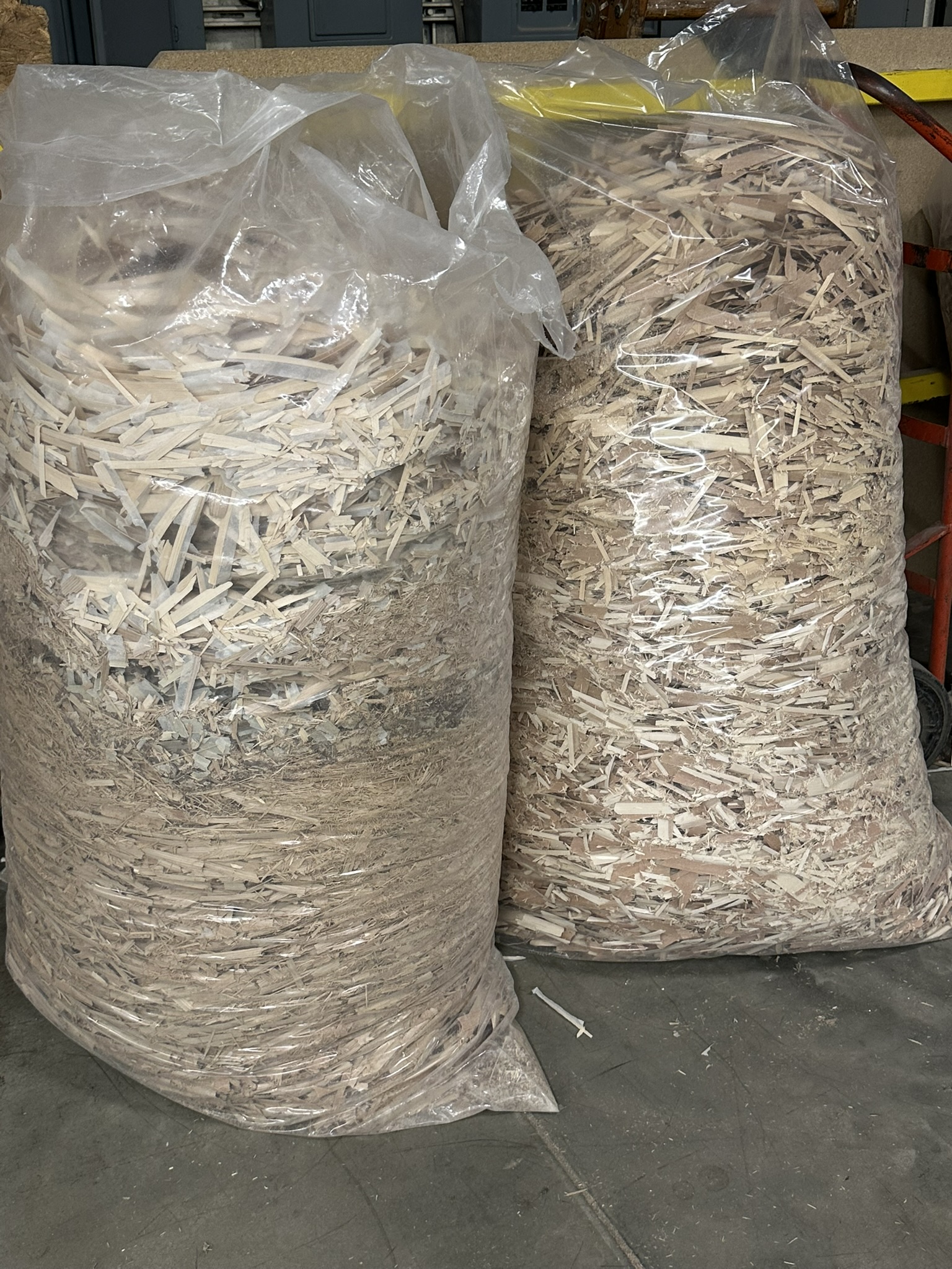 Two large bags of waste wood chippings