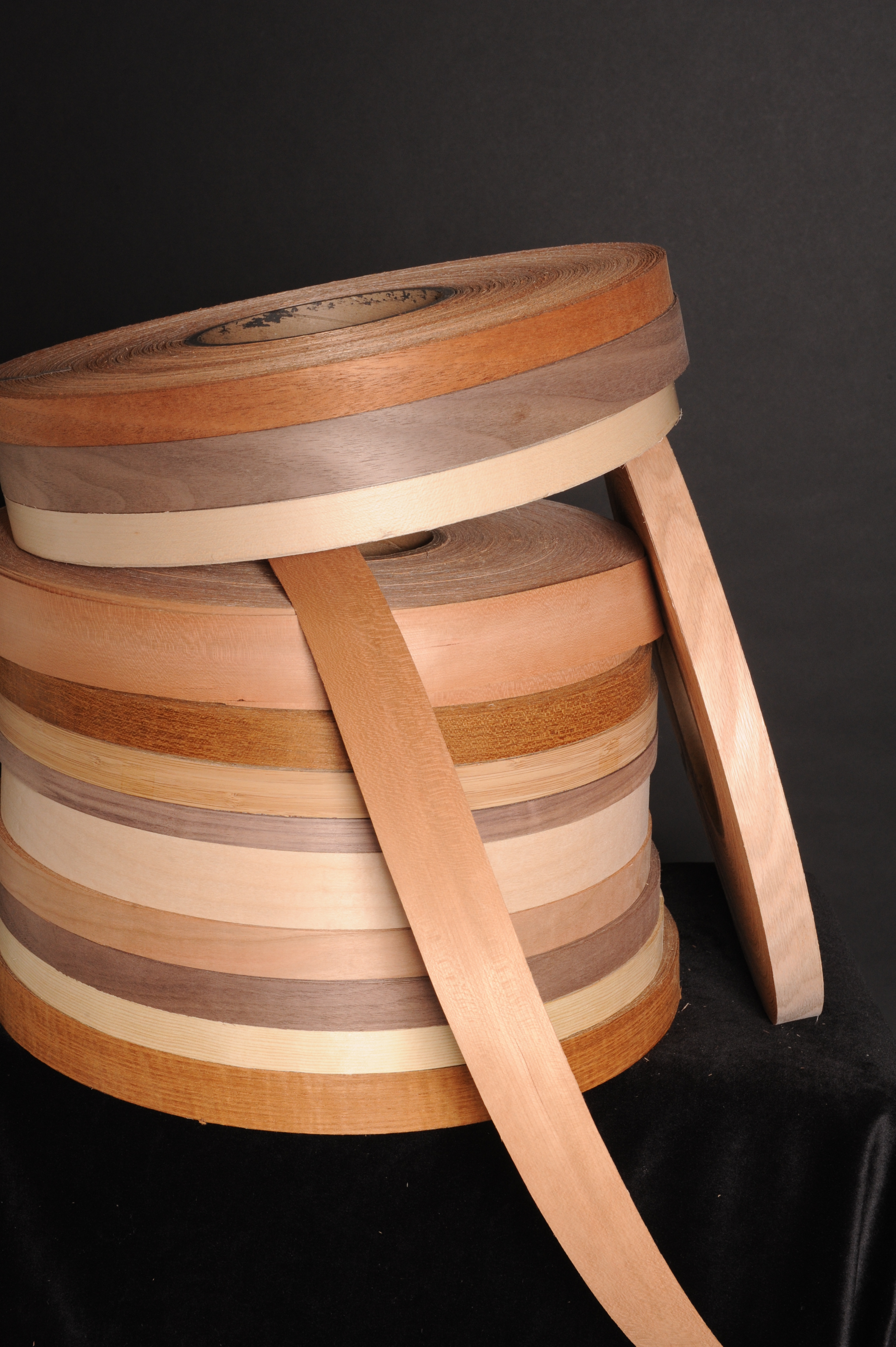 Stack of fleece edge veneer rolls